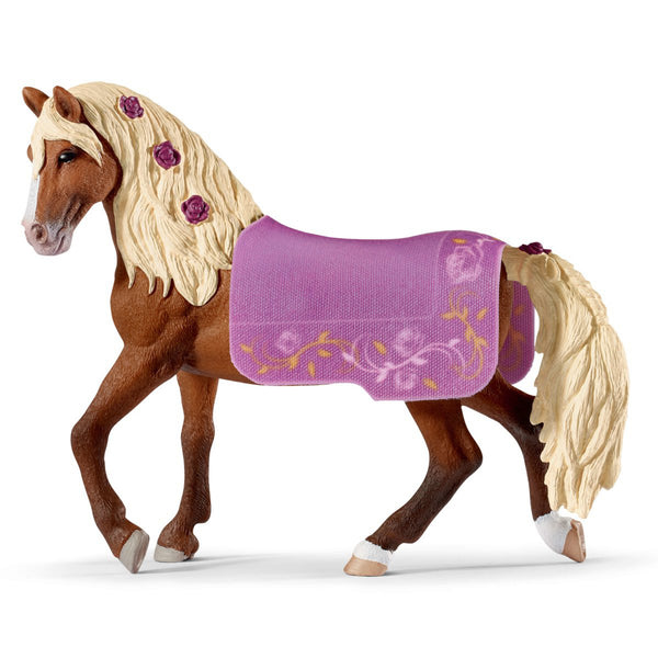 a brown horse with a blonde mane and purple flowers in its main that match its floral purple saddle blanket