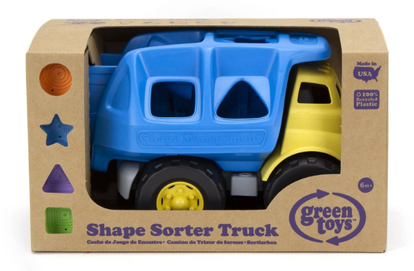 the green toys shape sorter truck with holes and shapes including a circle star triangle and square