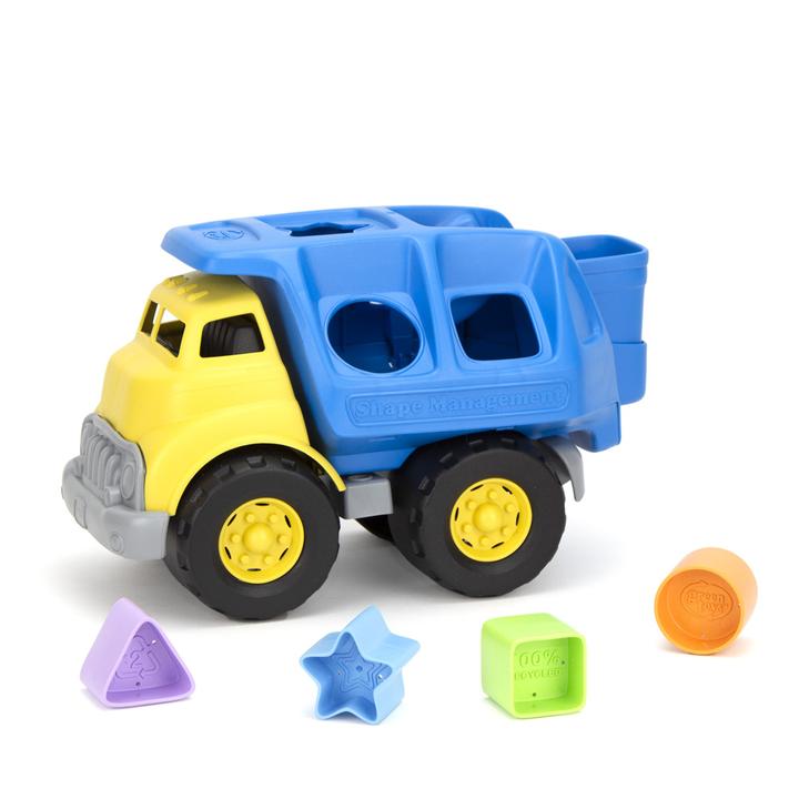 the shapes of the green toys shape truck there is a purple triangle a blue star a green square and an orange circle